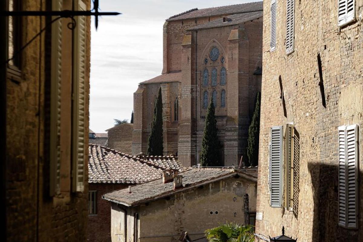 an old building with a church in a city