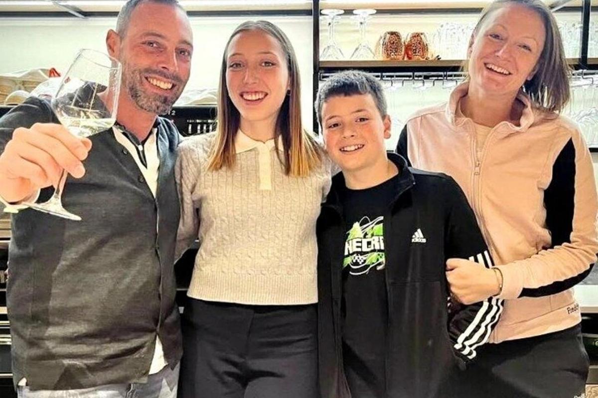 a family poses for a picture in a supermarket