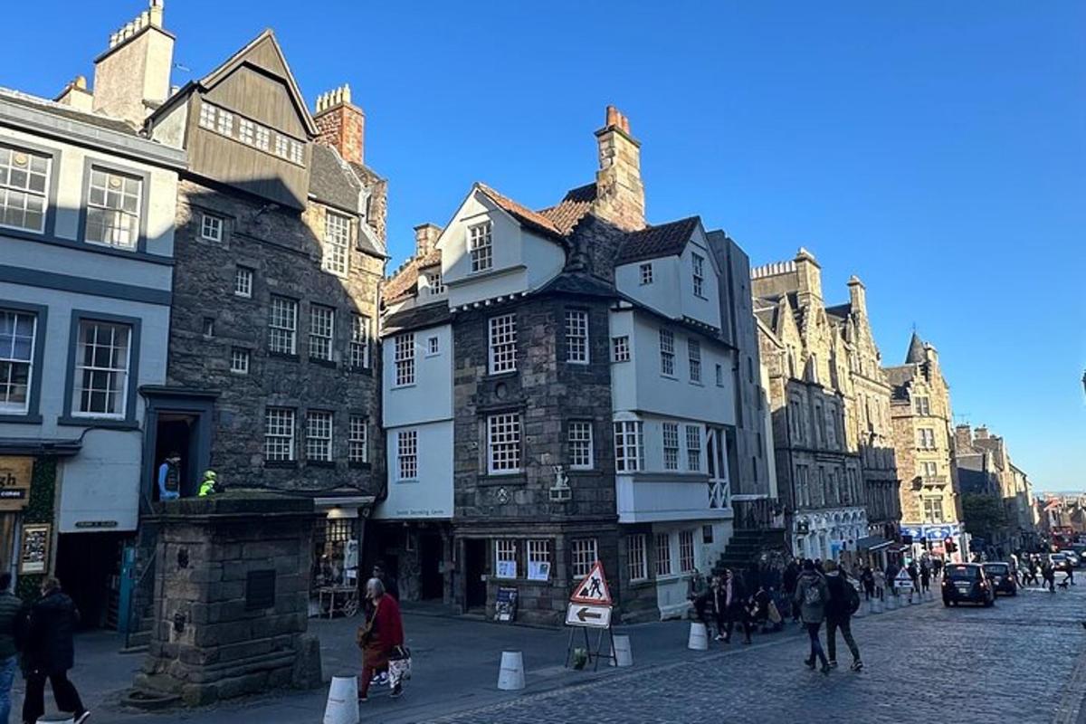 a group of buildings on a cobblestone street