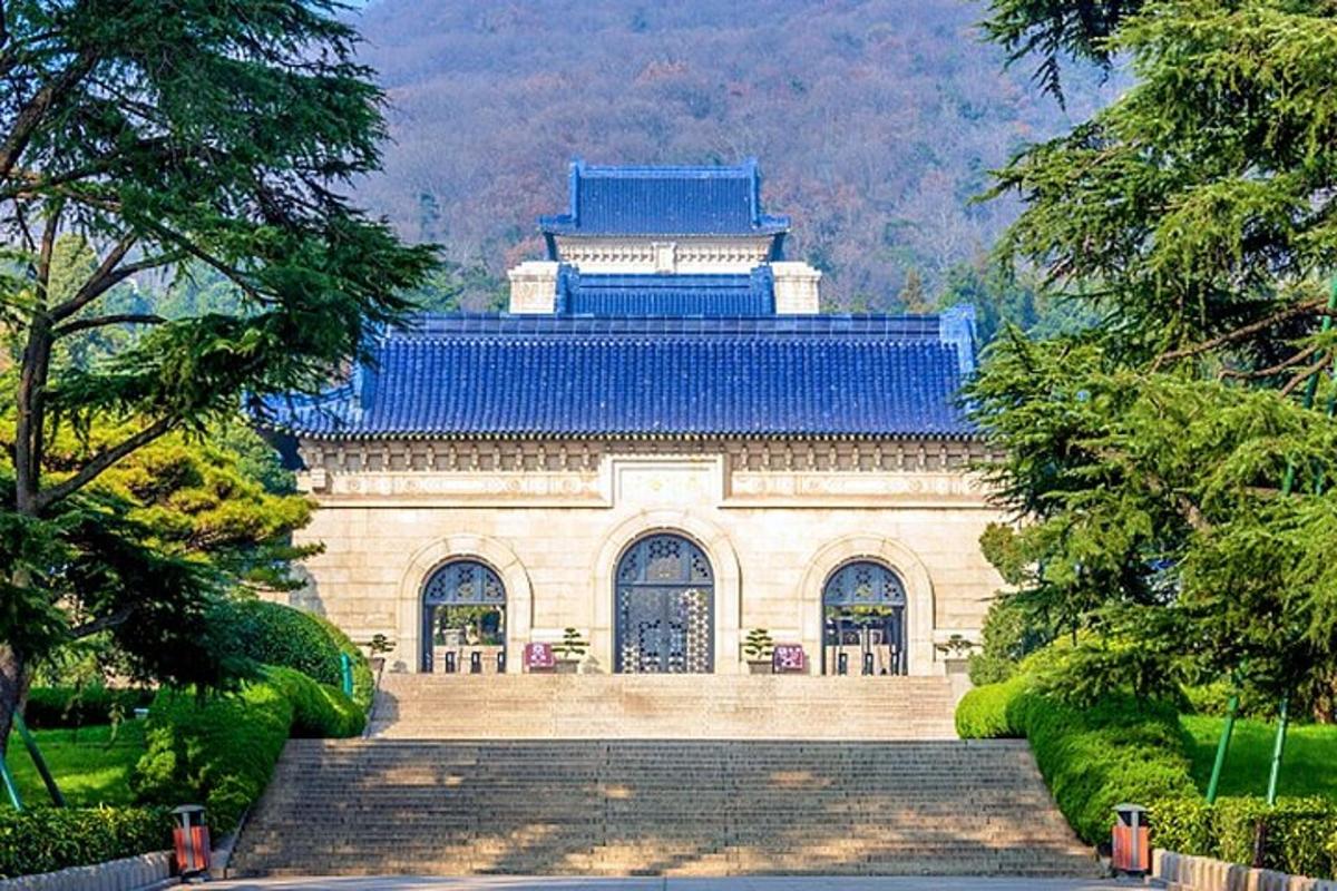a large building with a blue roof and stairs