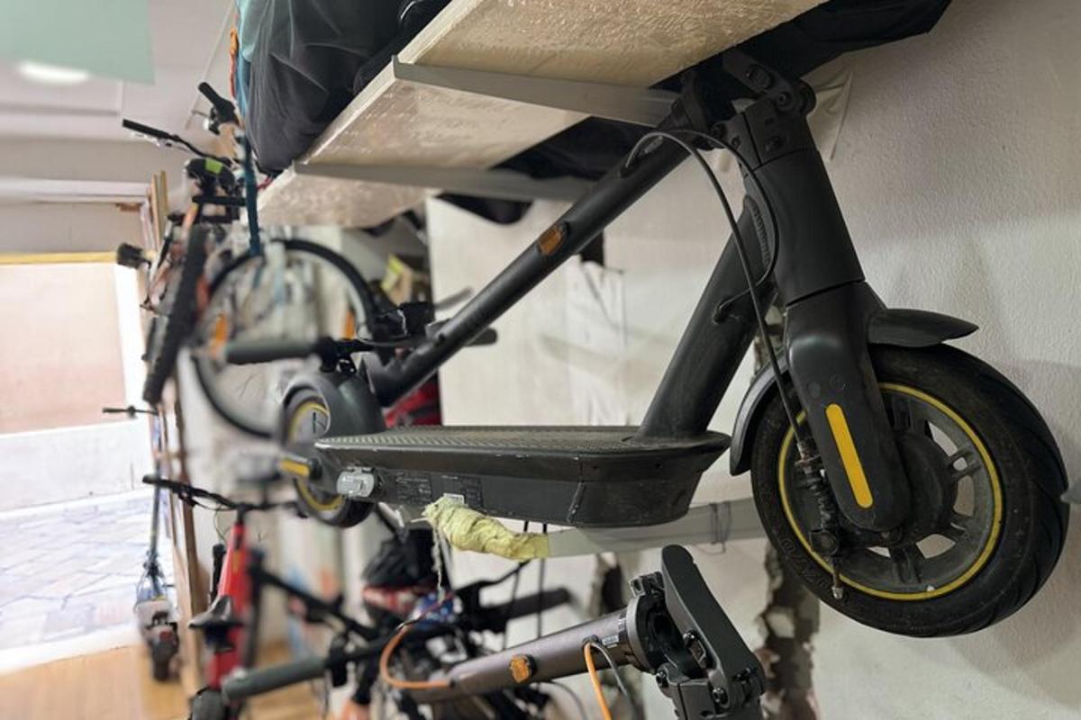 a motor bike hanging on a wall with other bikes