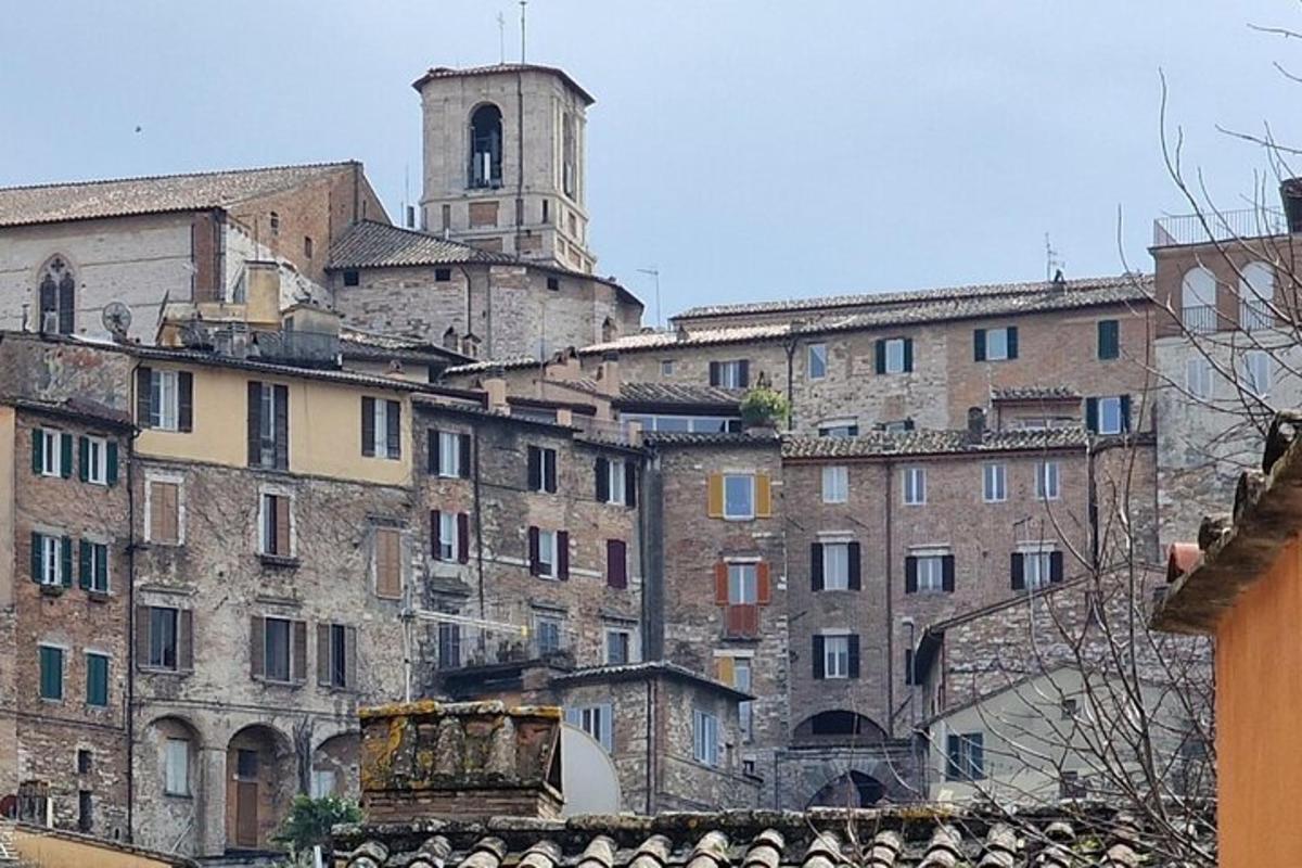 a group of buildings with a clock tower in the background