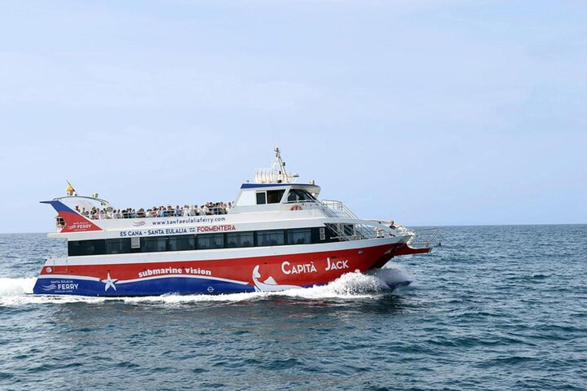 a red and white boat in the water