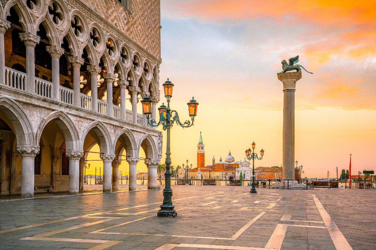 a building with a statue of a person on a column