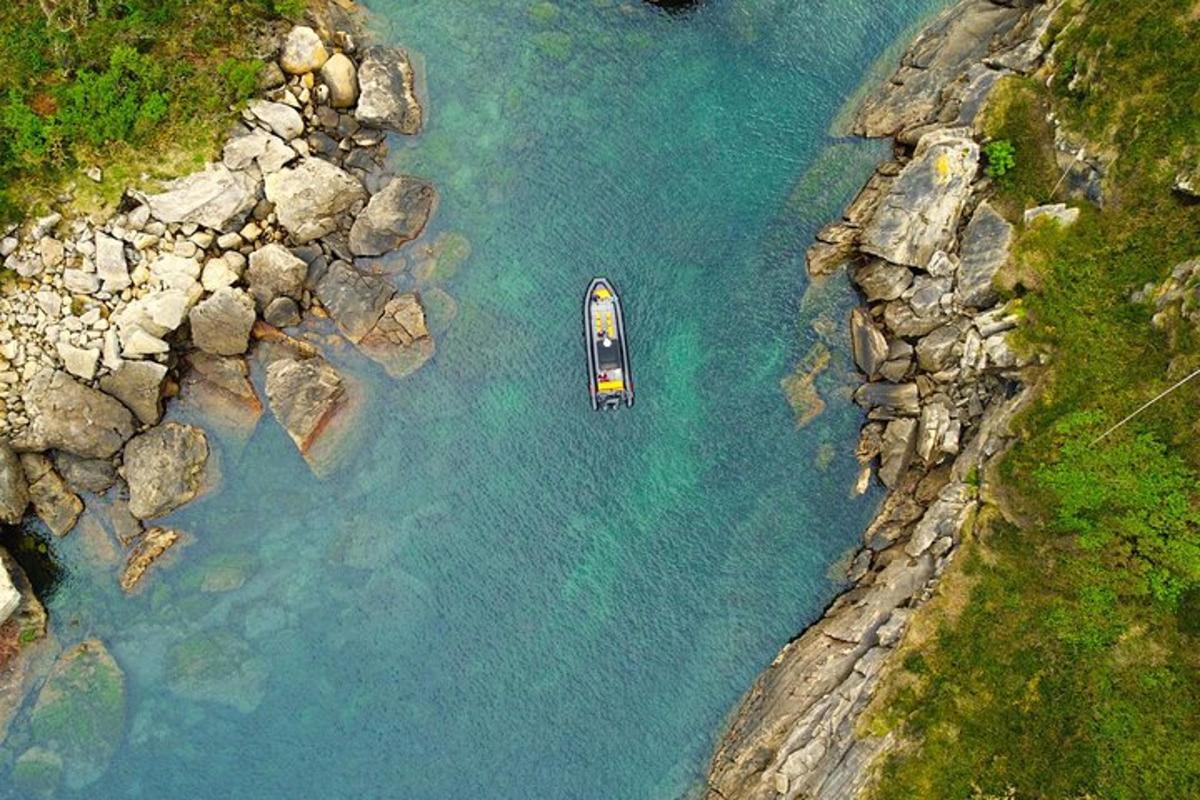 an aerial view of a boat in the water