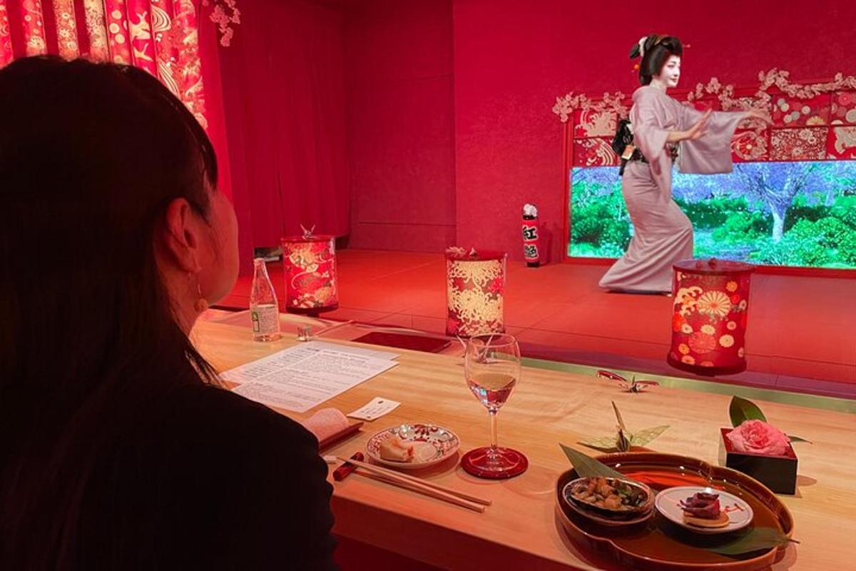 a man sitting at a table with a woman in a performance