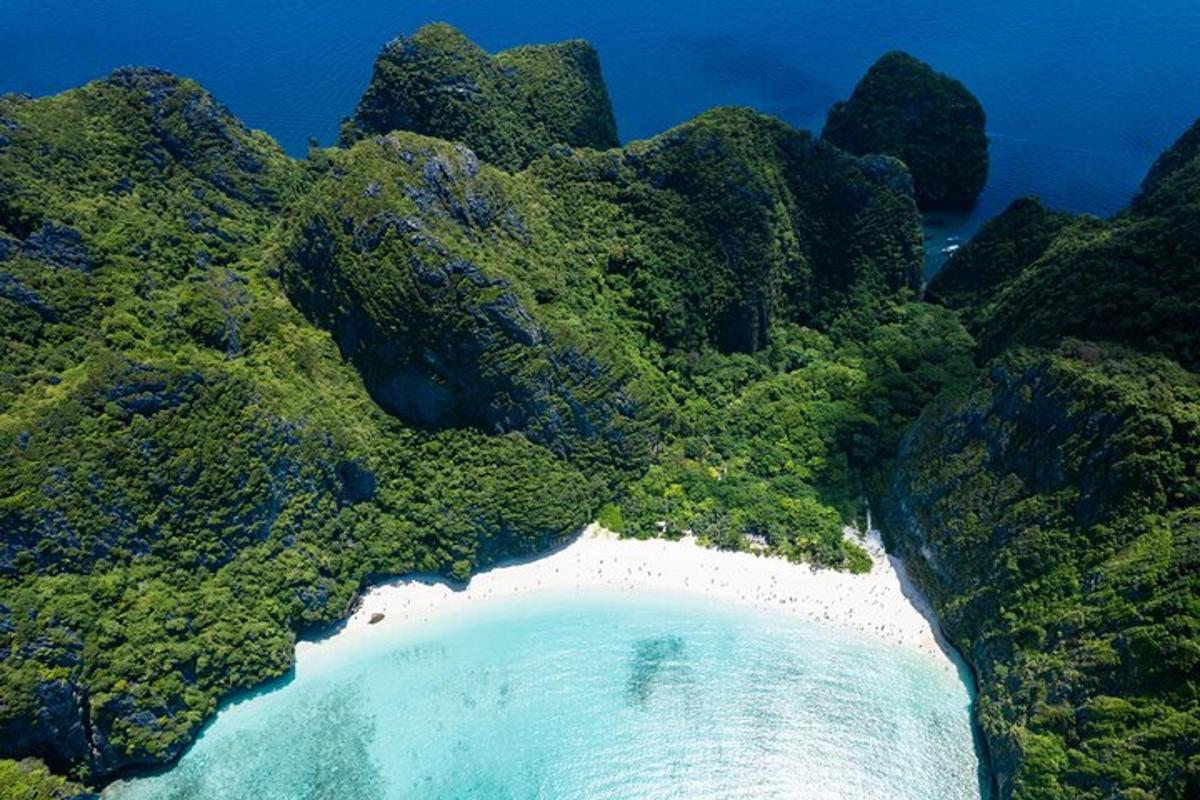 an aerial view of a beach in the middle of the ocean