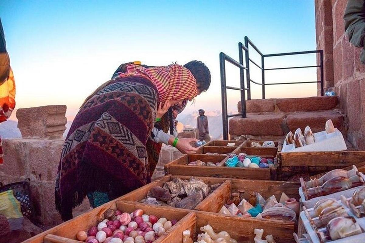 a woman standing in front of boxes of food