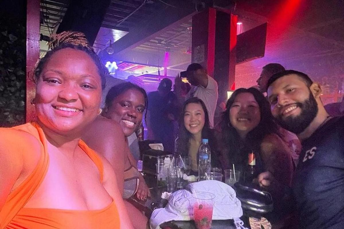 a group of people posing for a picture in a bar