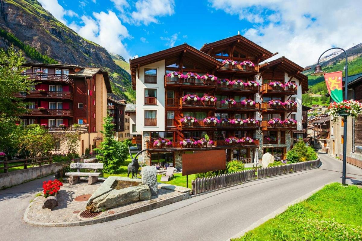 a building with flowers on the side of it