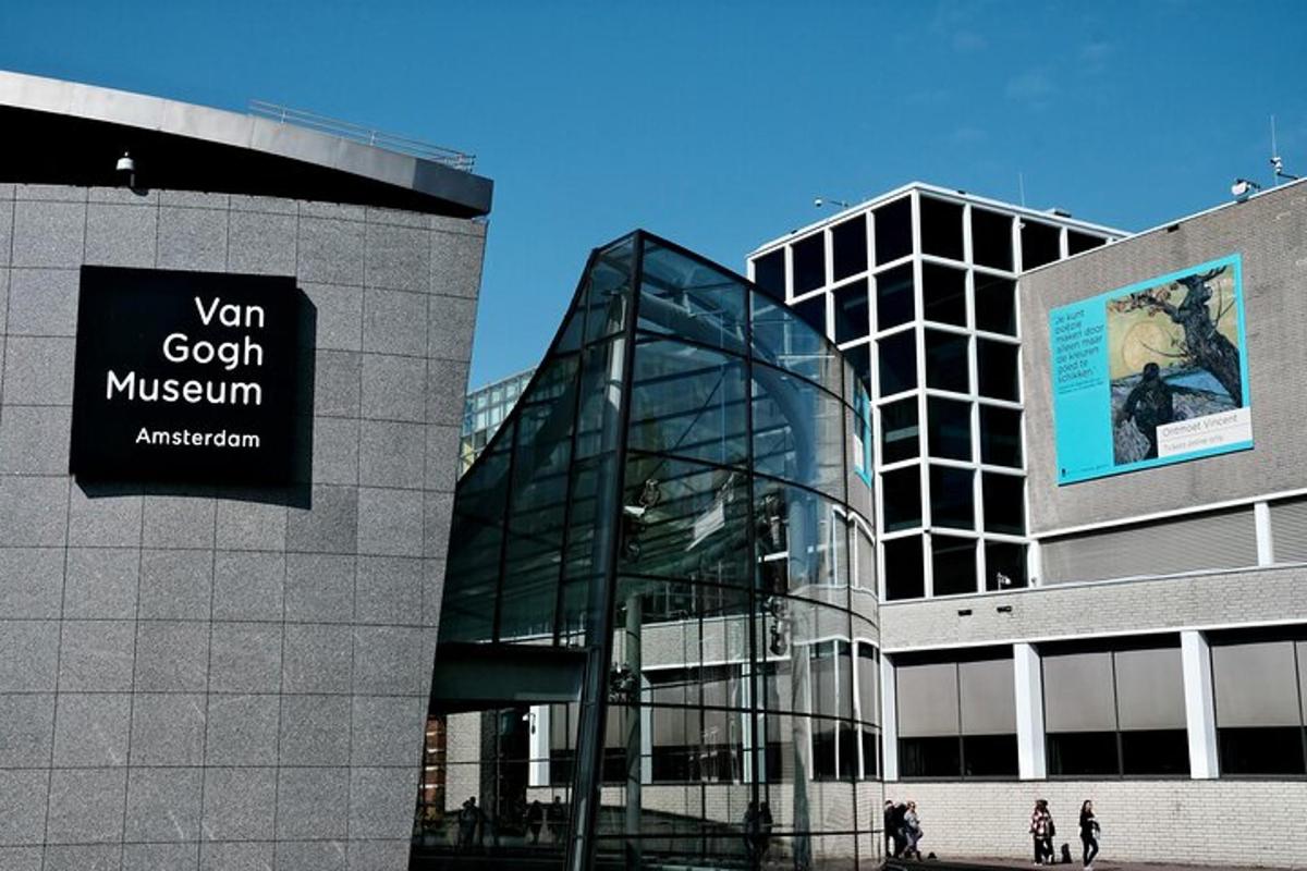 a glass building with a sign on the side of it