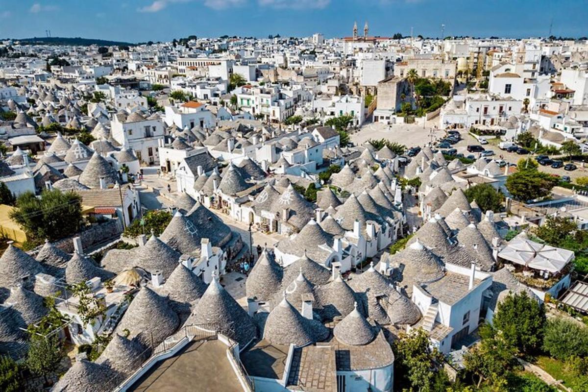 an aerial view of a city with white houses