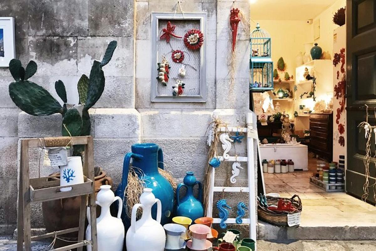 a room with a bunch of blue vases on the floor