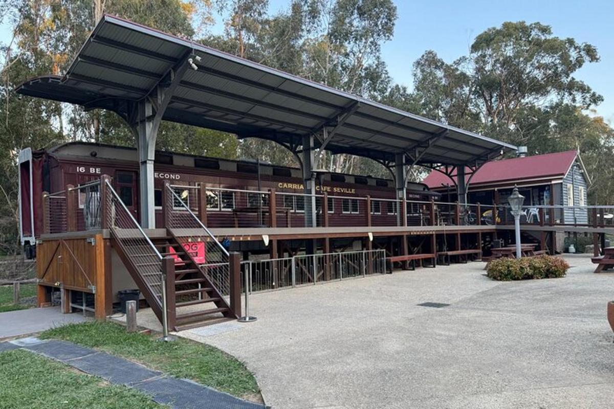 a train station with awning and stairs in front of it