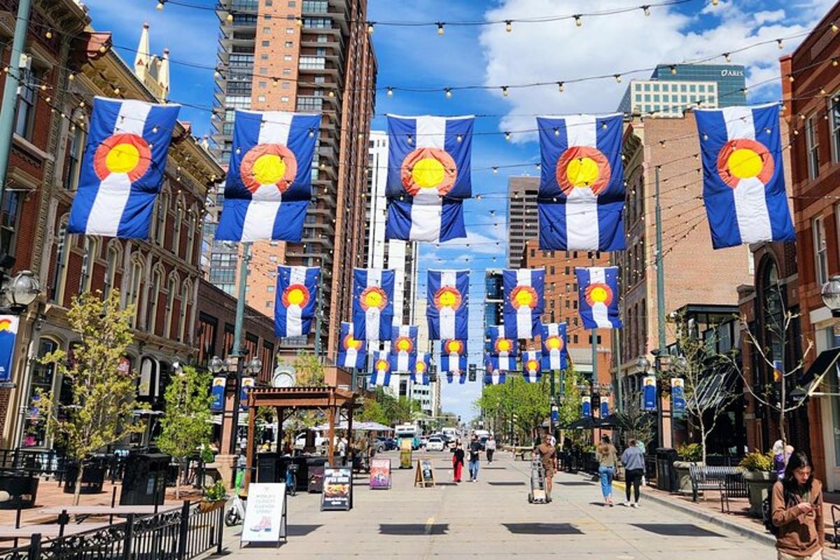 a street with flags and people walking down a street