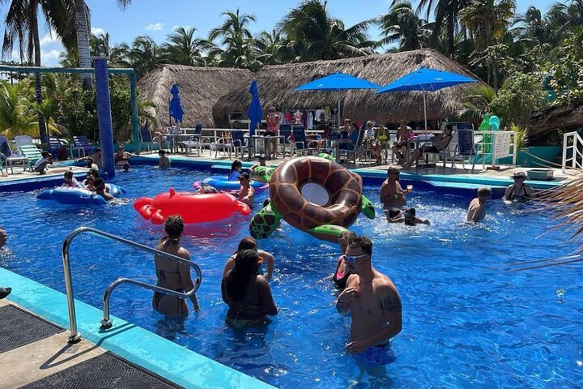 a group of people in the water at a swimming pool