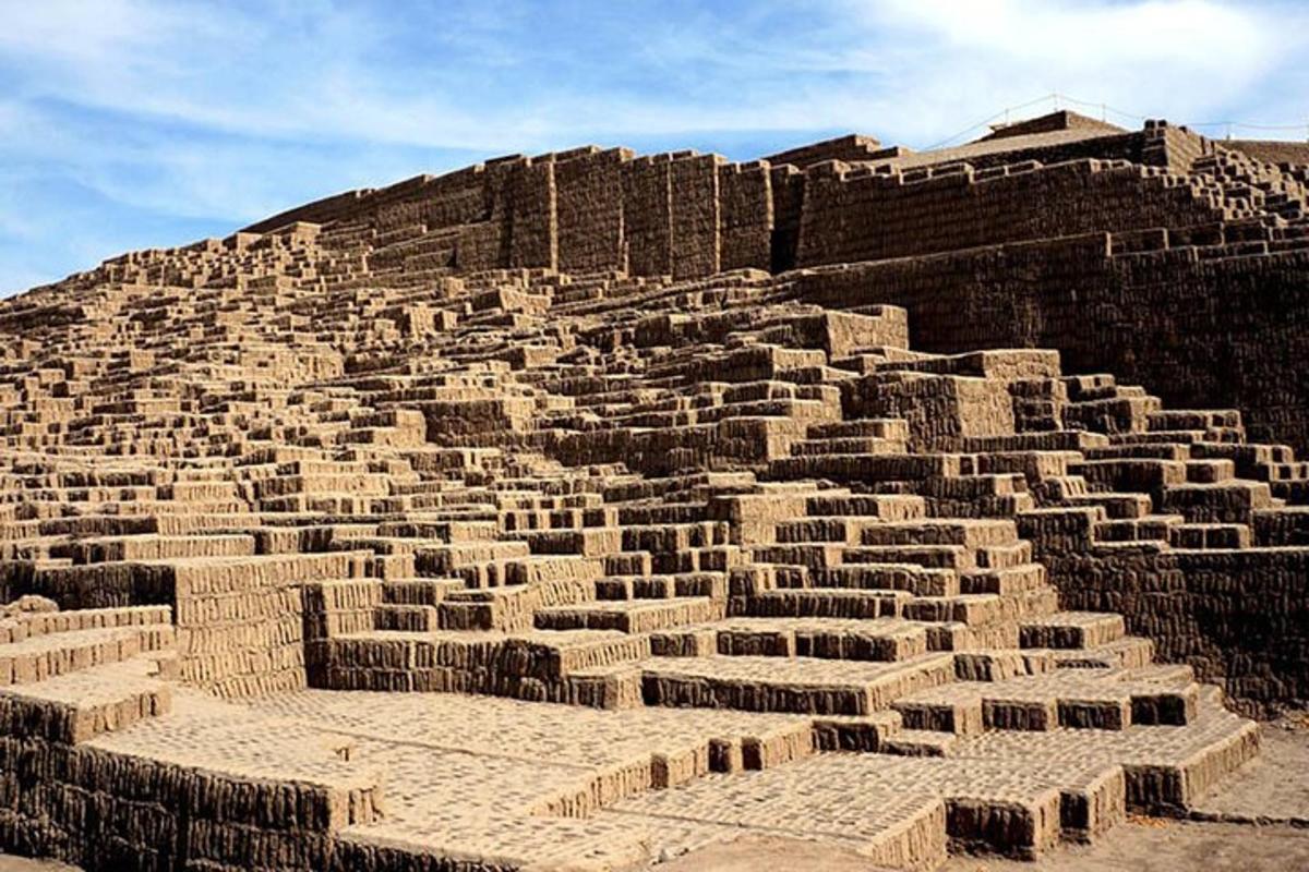 a large brick building on top of a hill