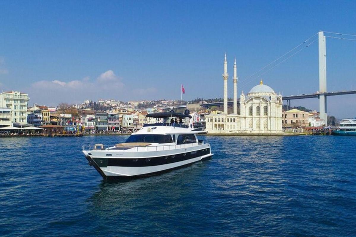 a boat in the water with a bridge in the background