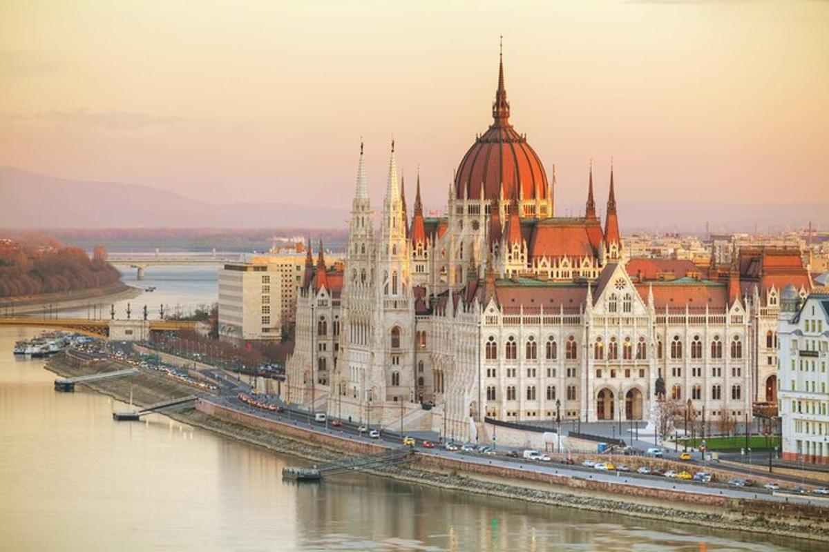 a large building with a dome on top next to a river