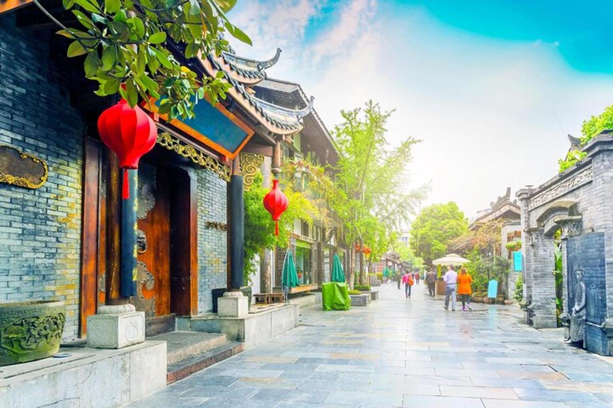 a street with buildings and people walking down a street