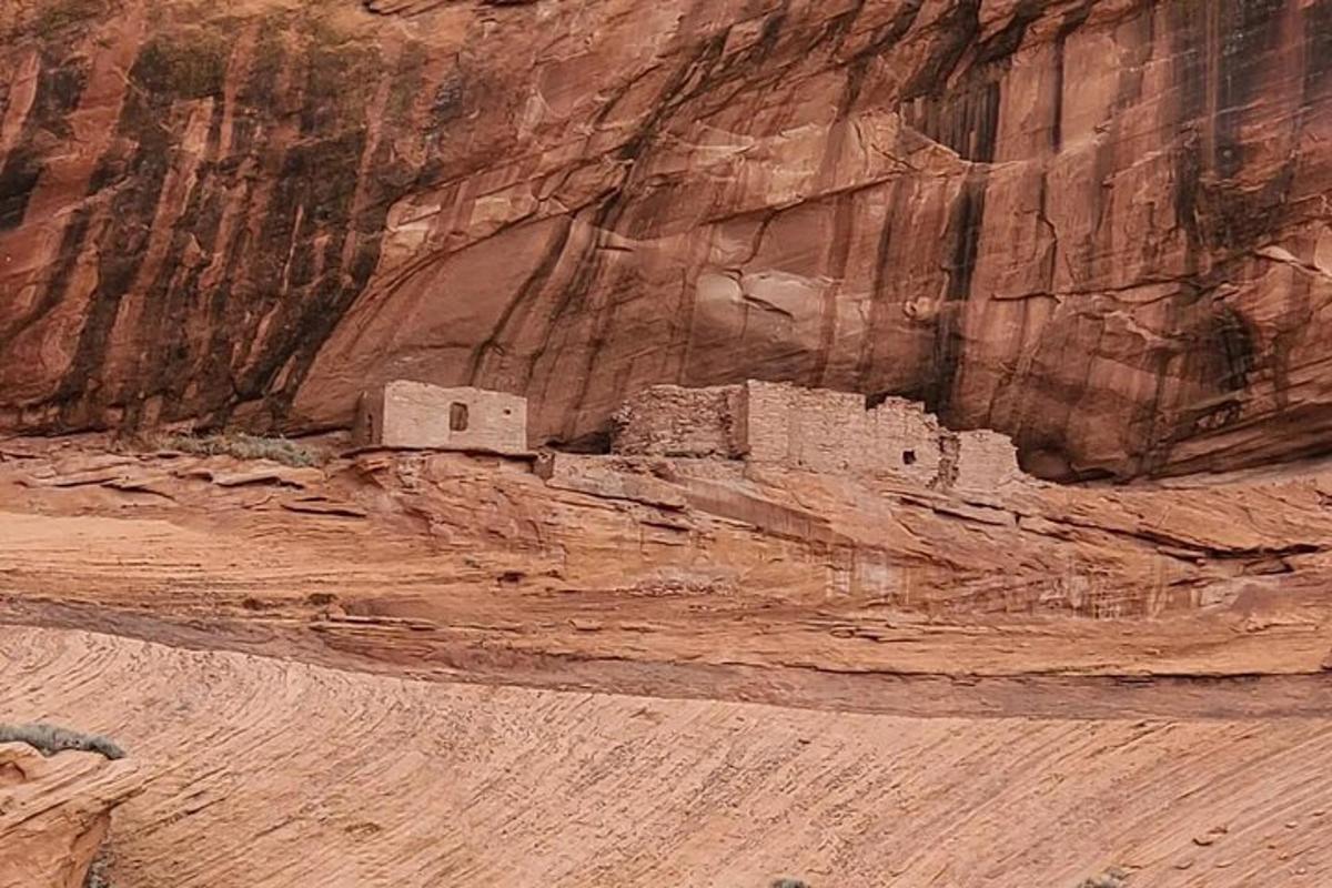 a building on the side of a rocky mountain