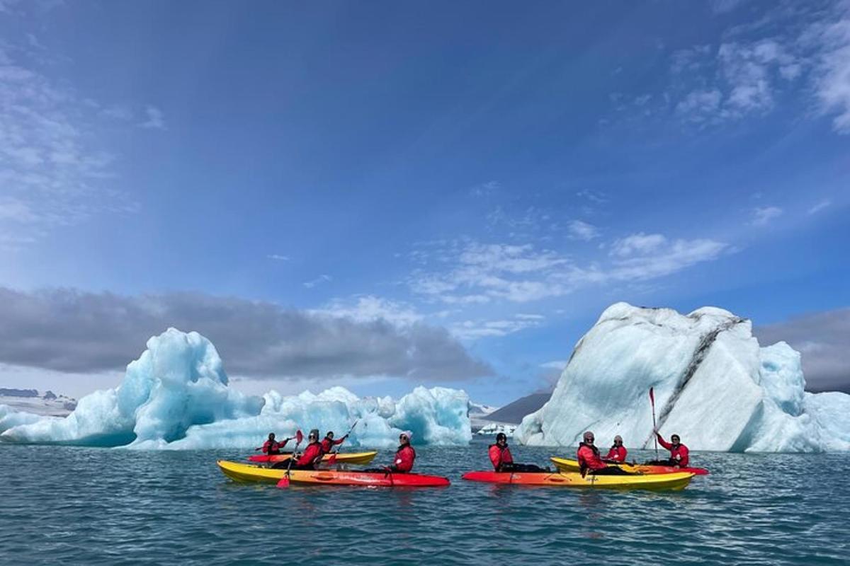 a group of people in kayaks in front of an iceberg