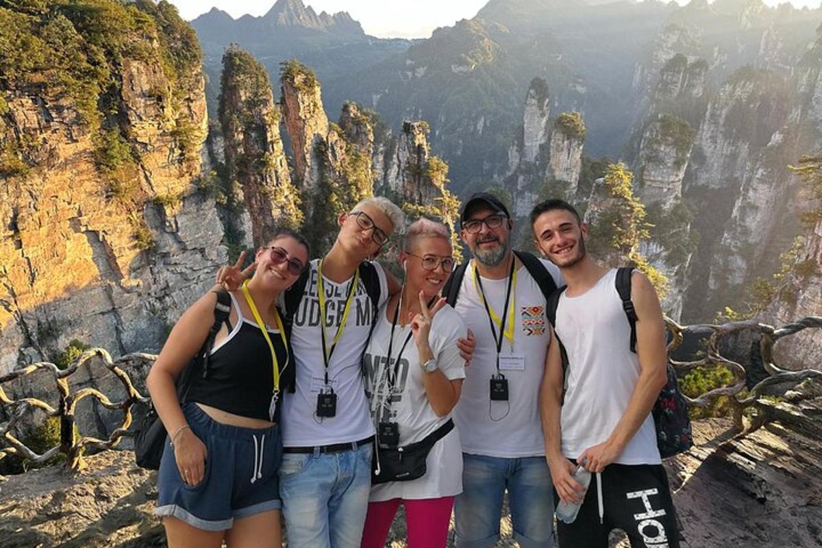a group of people standing on top of a mountain