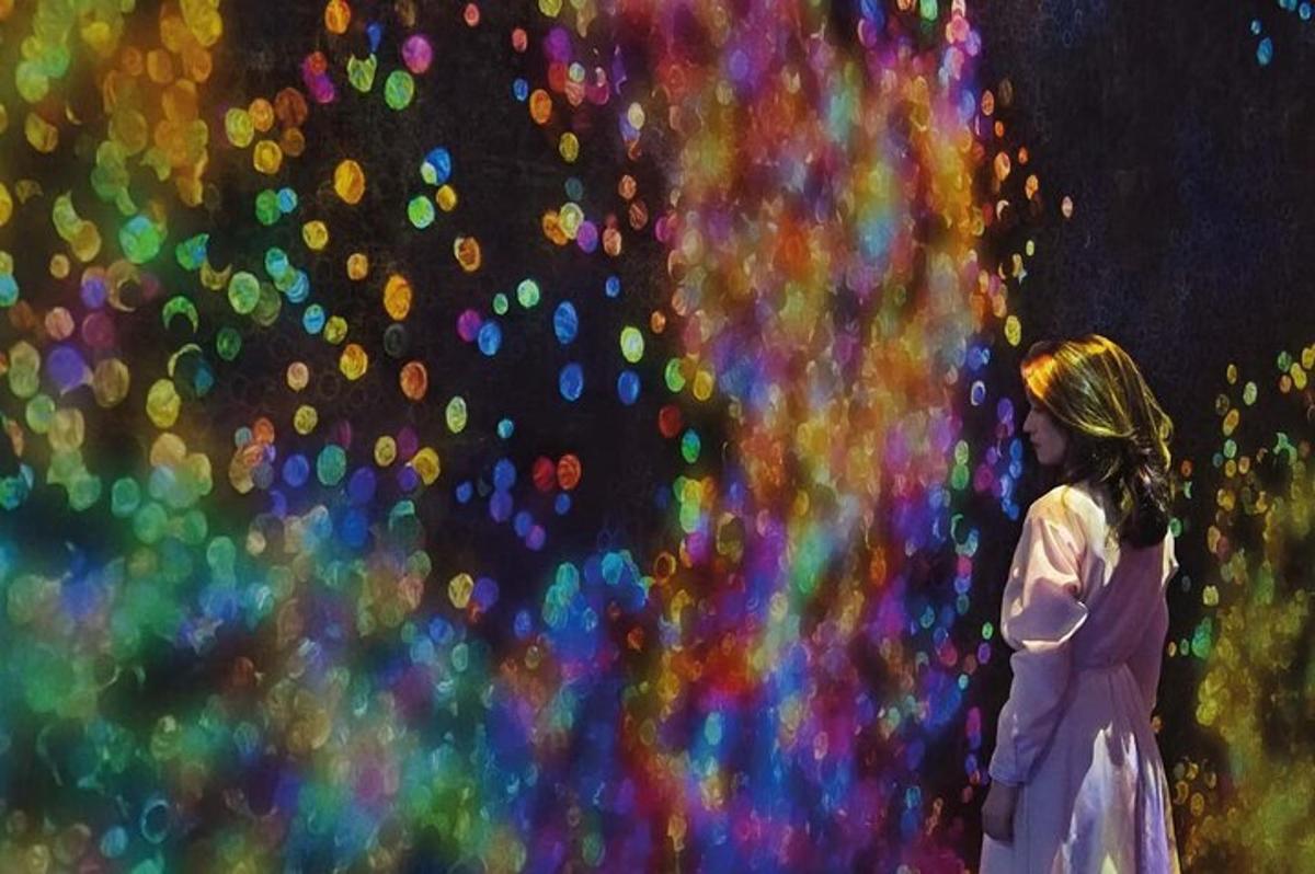 a girl in a white dress standing in front of a wall