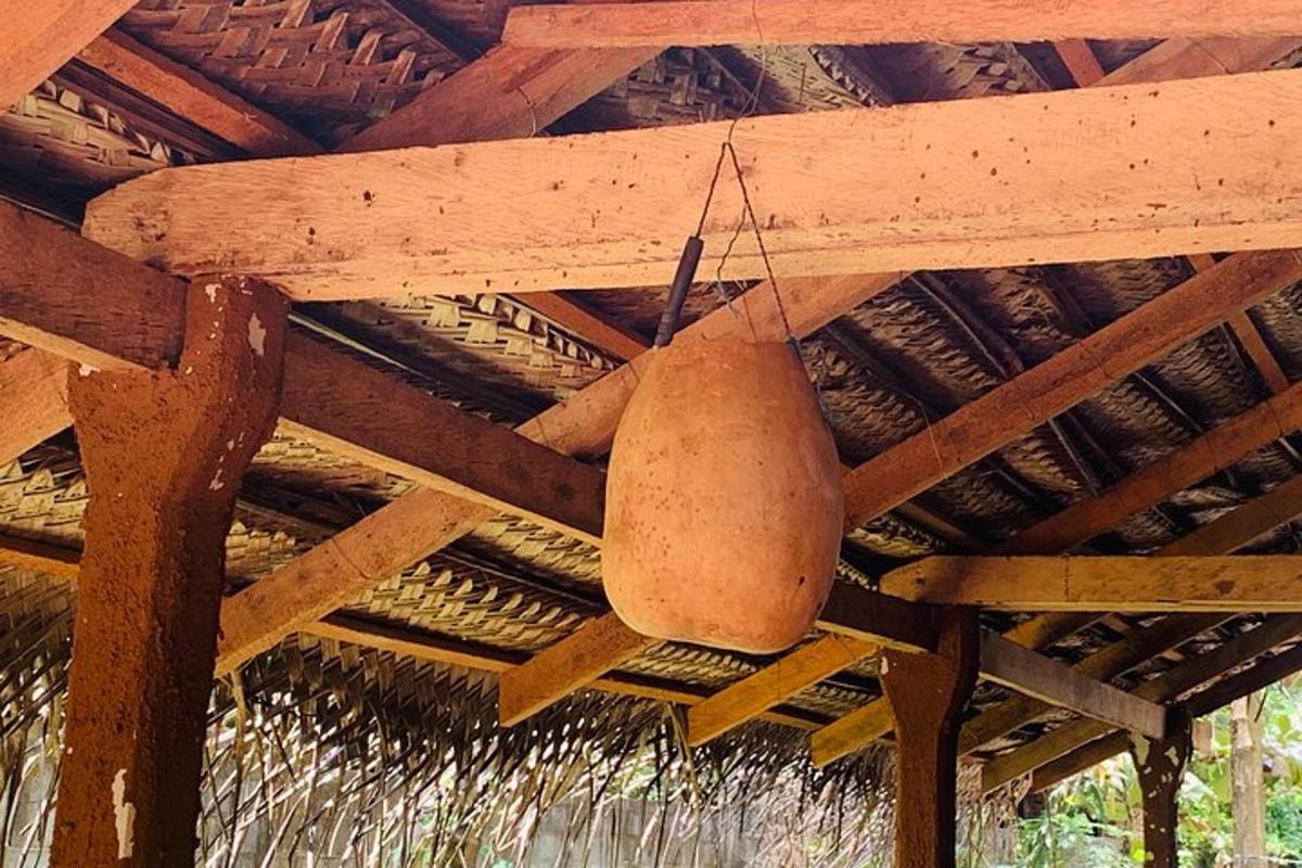 a pot hanging from the ceiling of a hut