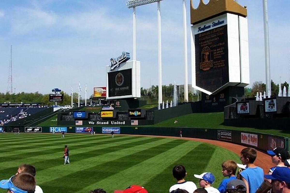 a crowd of people watching a baseball game on a field
