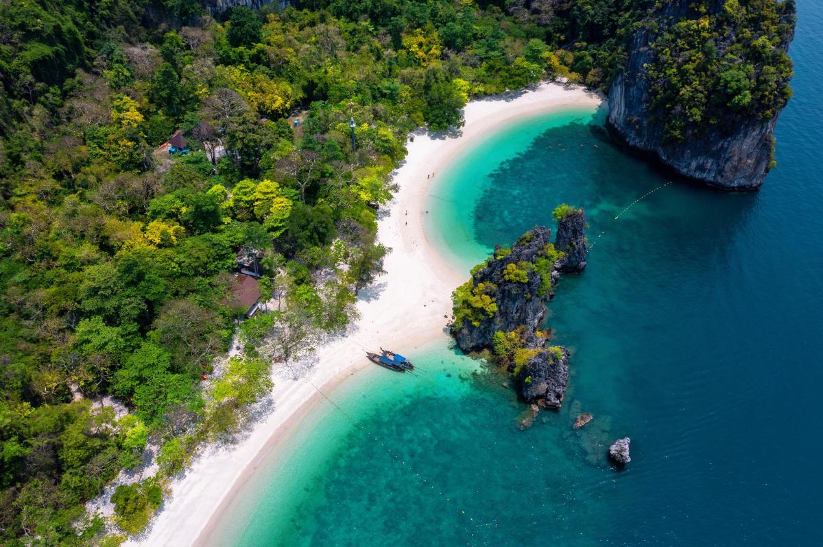 an aerial view of an island with a beach
