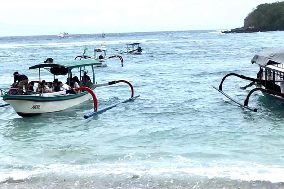 a group of people on a boat in the water