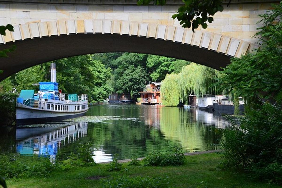a bridge over a river with a boat on it