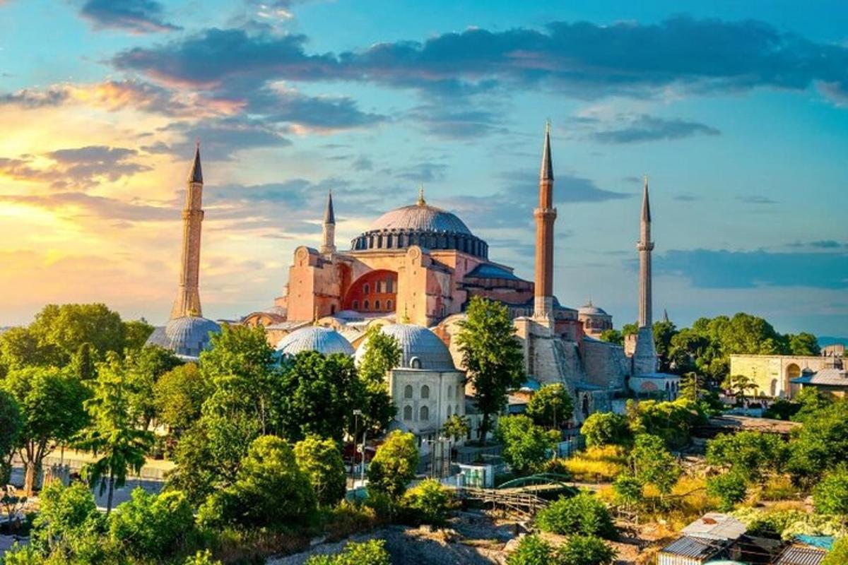 a large mosque with blue domes and minarets