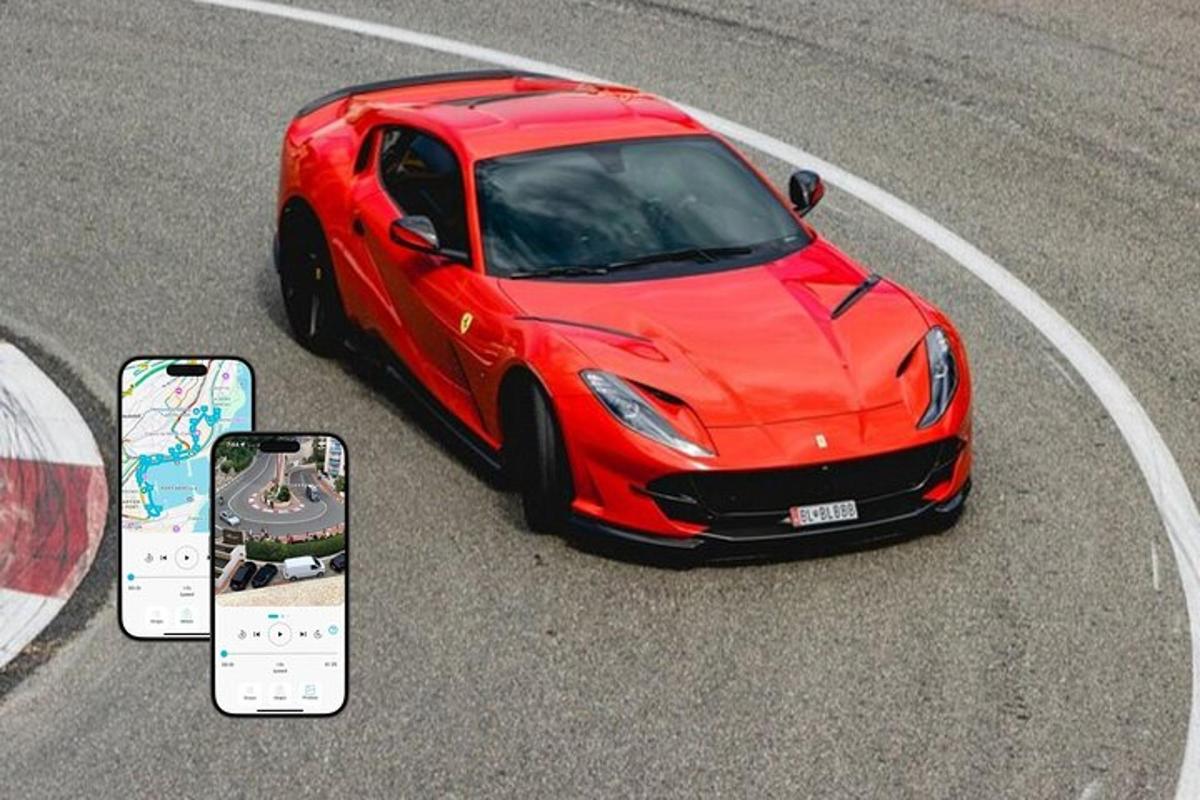 a red car driving on a road with a cell phone
