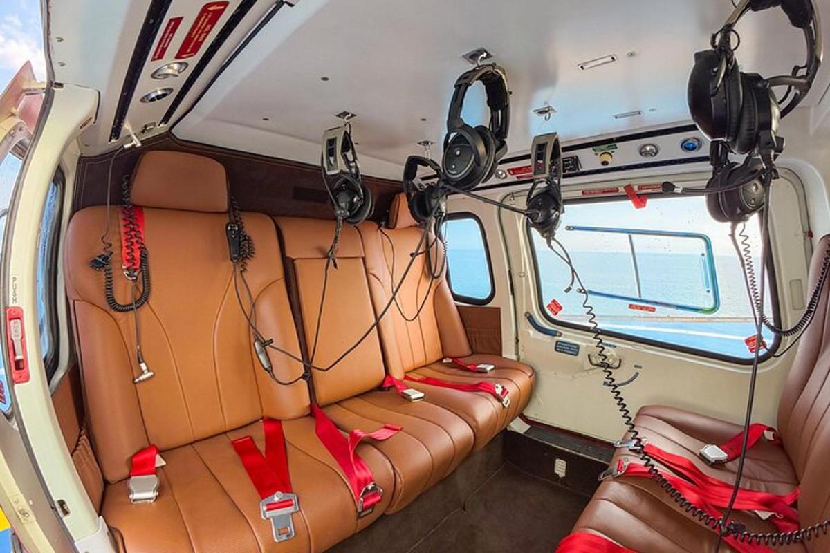 an inside view of an rv with a couch and headphones