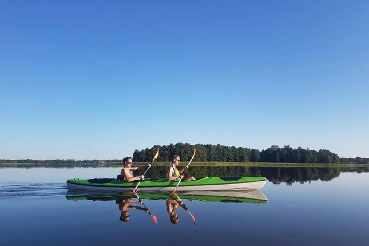 two people in a kayak on a lake