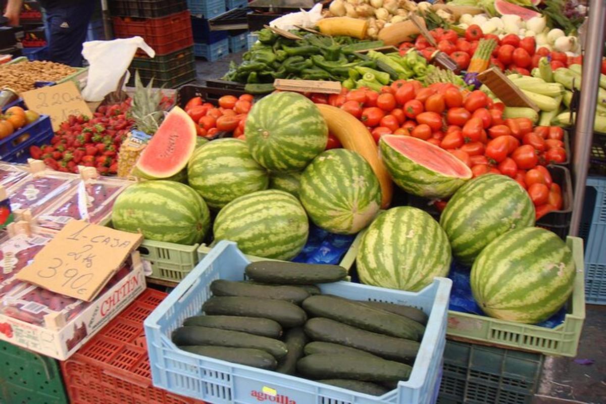 a display of fruits and vegetables in baskets at a market