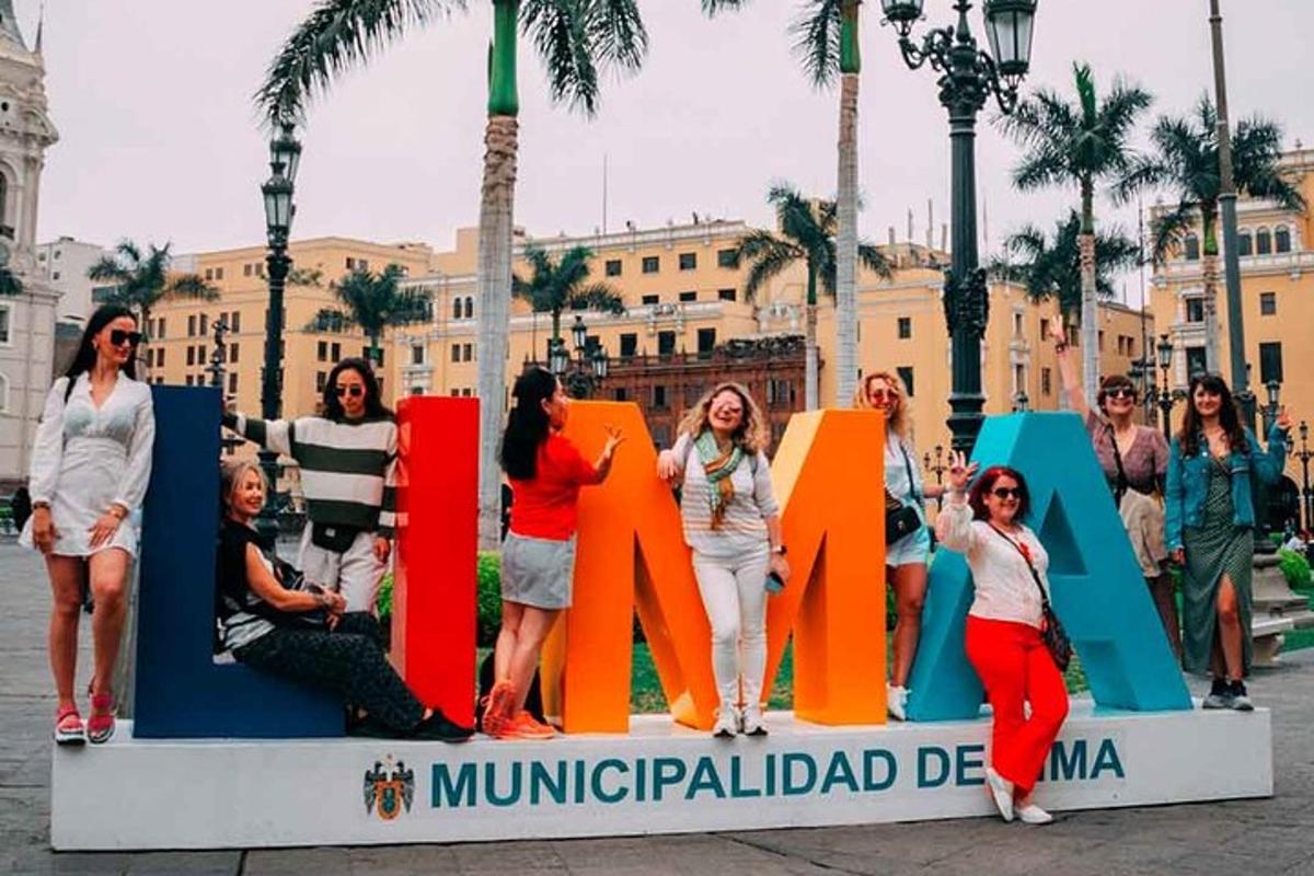 a group of people standing in front of a large sign