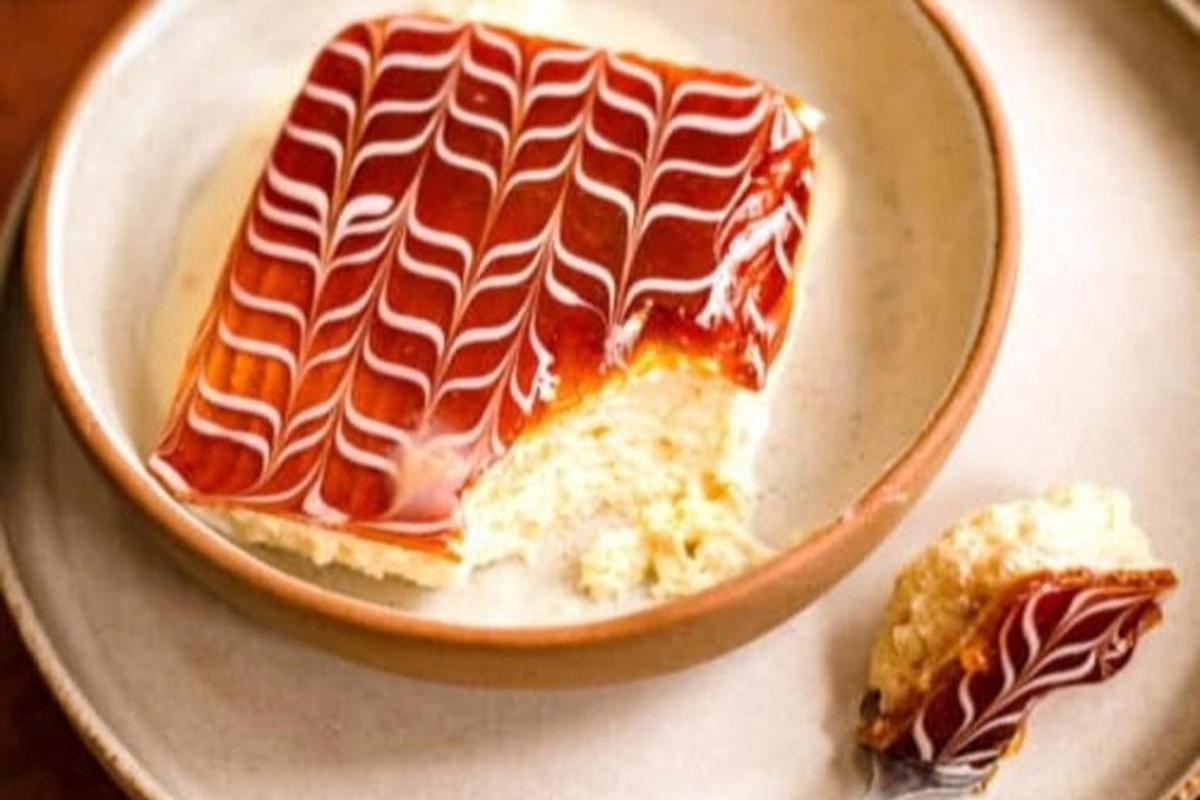 a bowl with a piece of food on a table