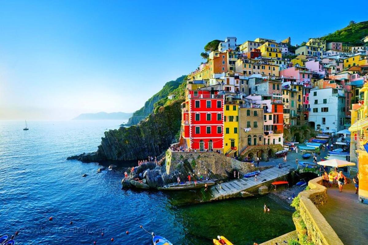 a group of colorful buildings on the side of the water