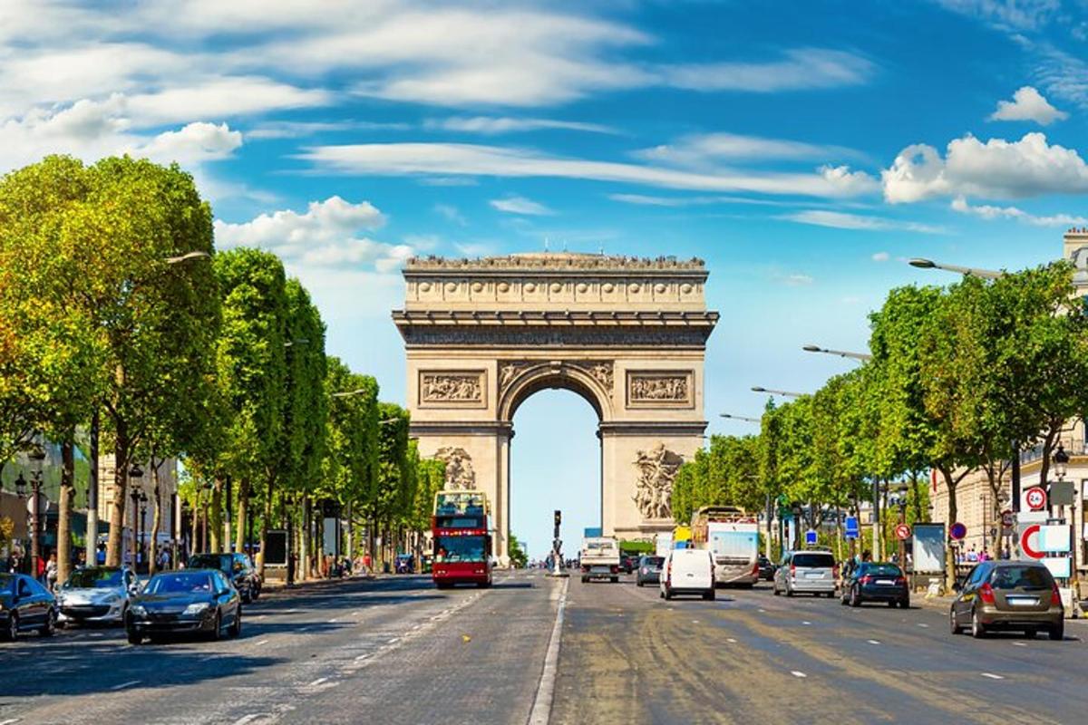 a view of the eiffel tower on a city street