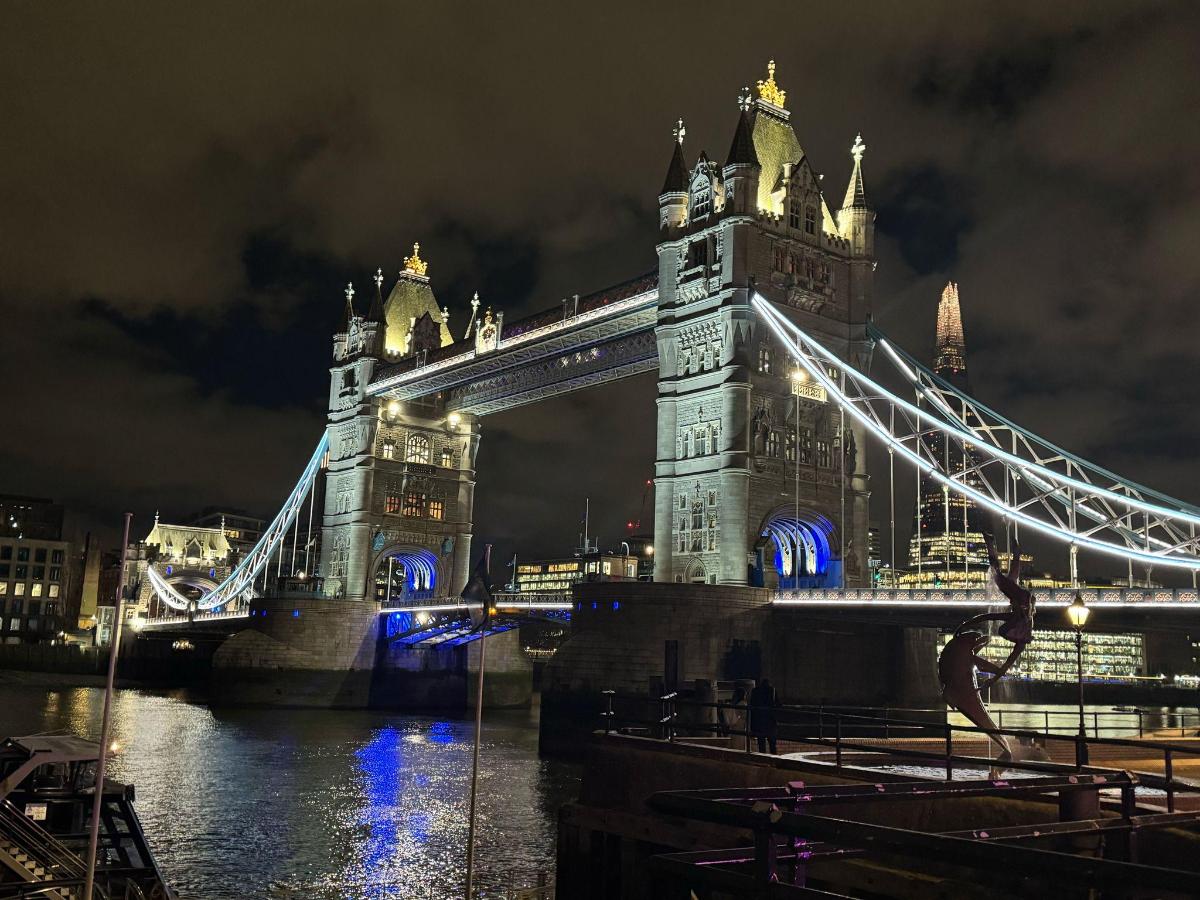 a view of the tower bridge at night