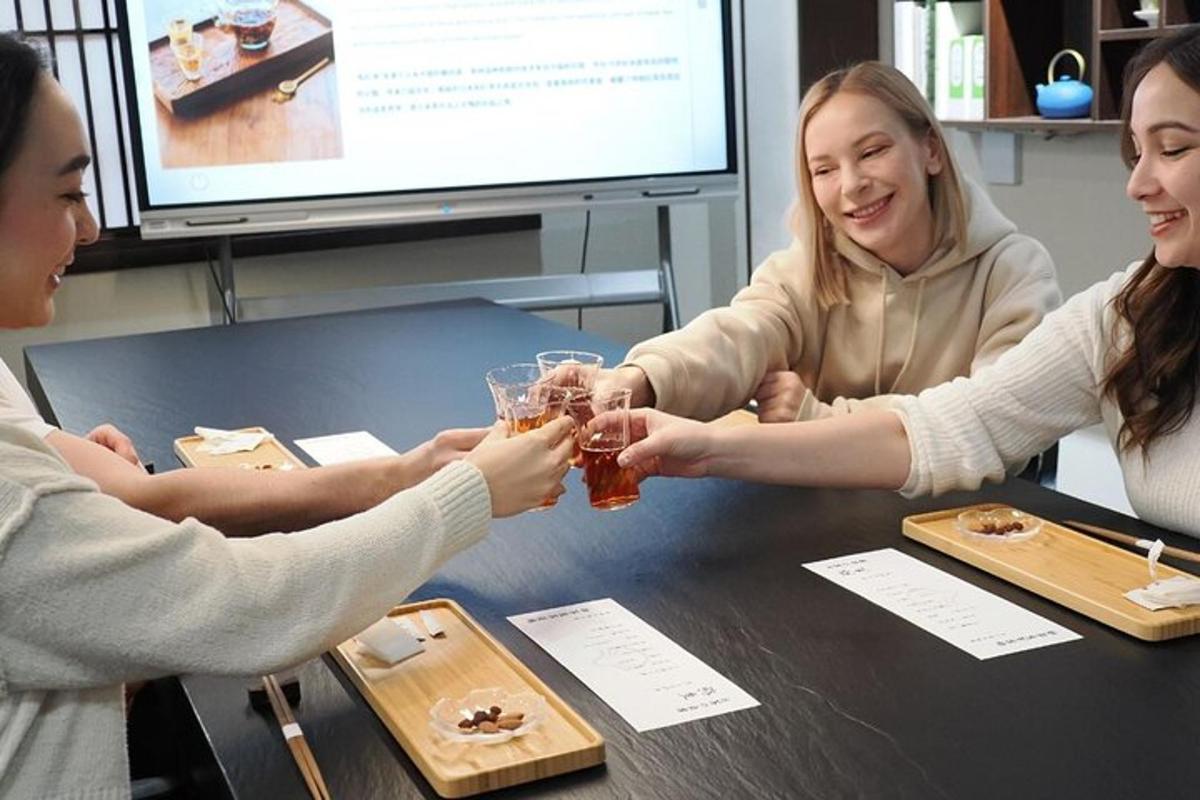 a group of people sitting around a table with glasses of beer