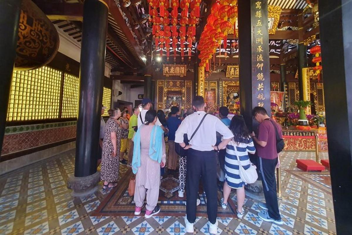 a group of people standing in a temple