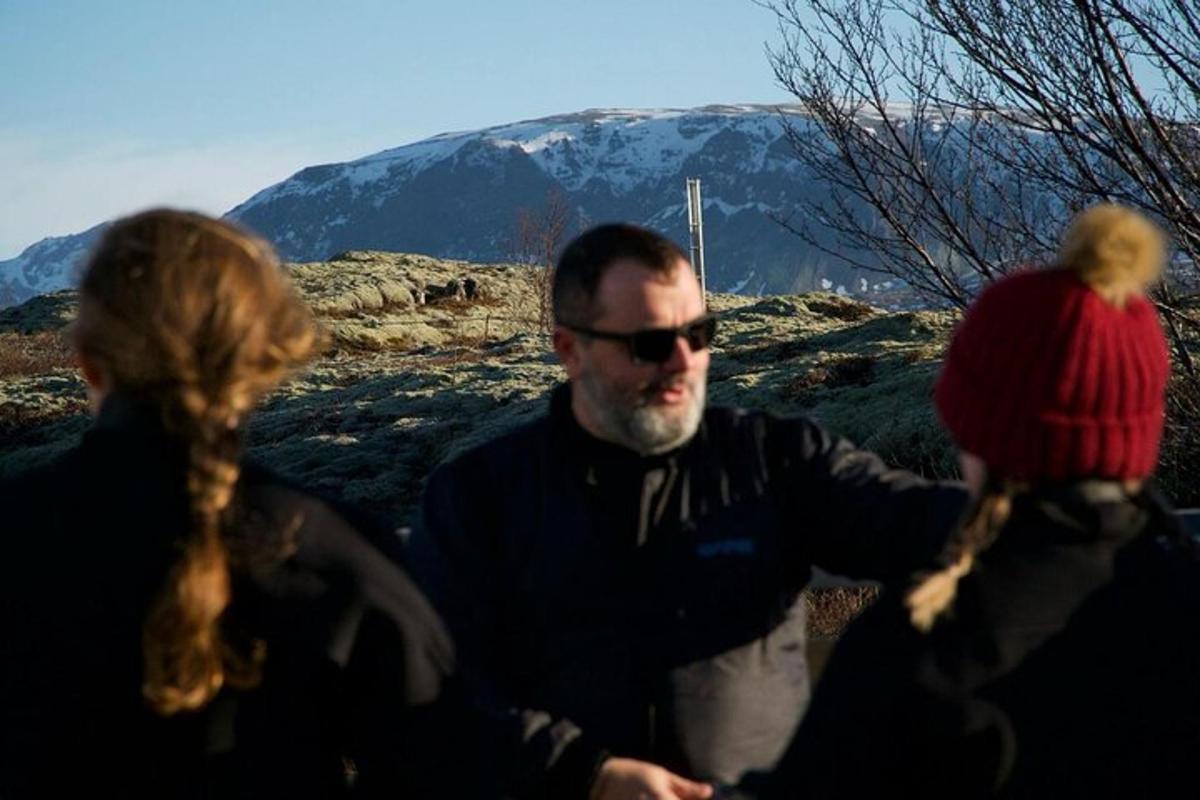 a man and two women standing next to each other