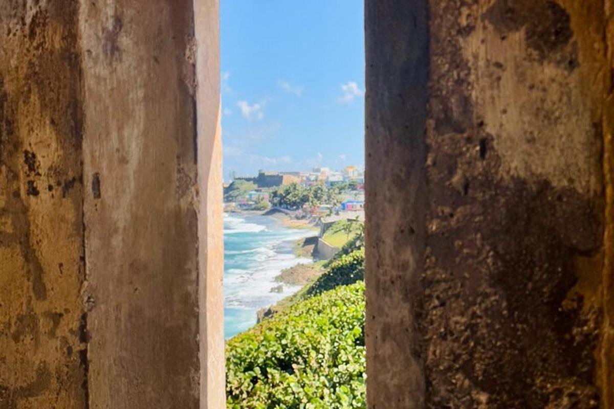 a view of the ocean from a window of a building