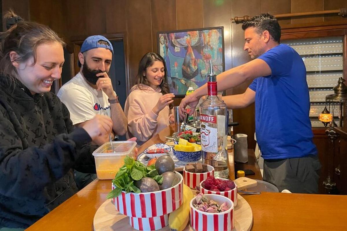 un groupe de personnes debout autour d'une table avec une bouteille de vin