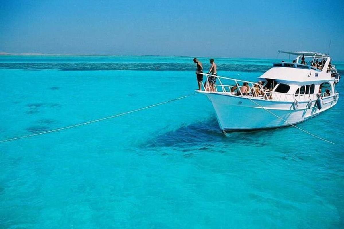 a group of people on a boat in the ocean