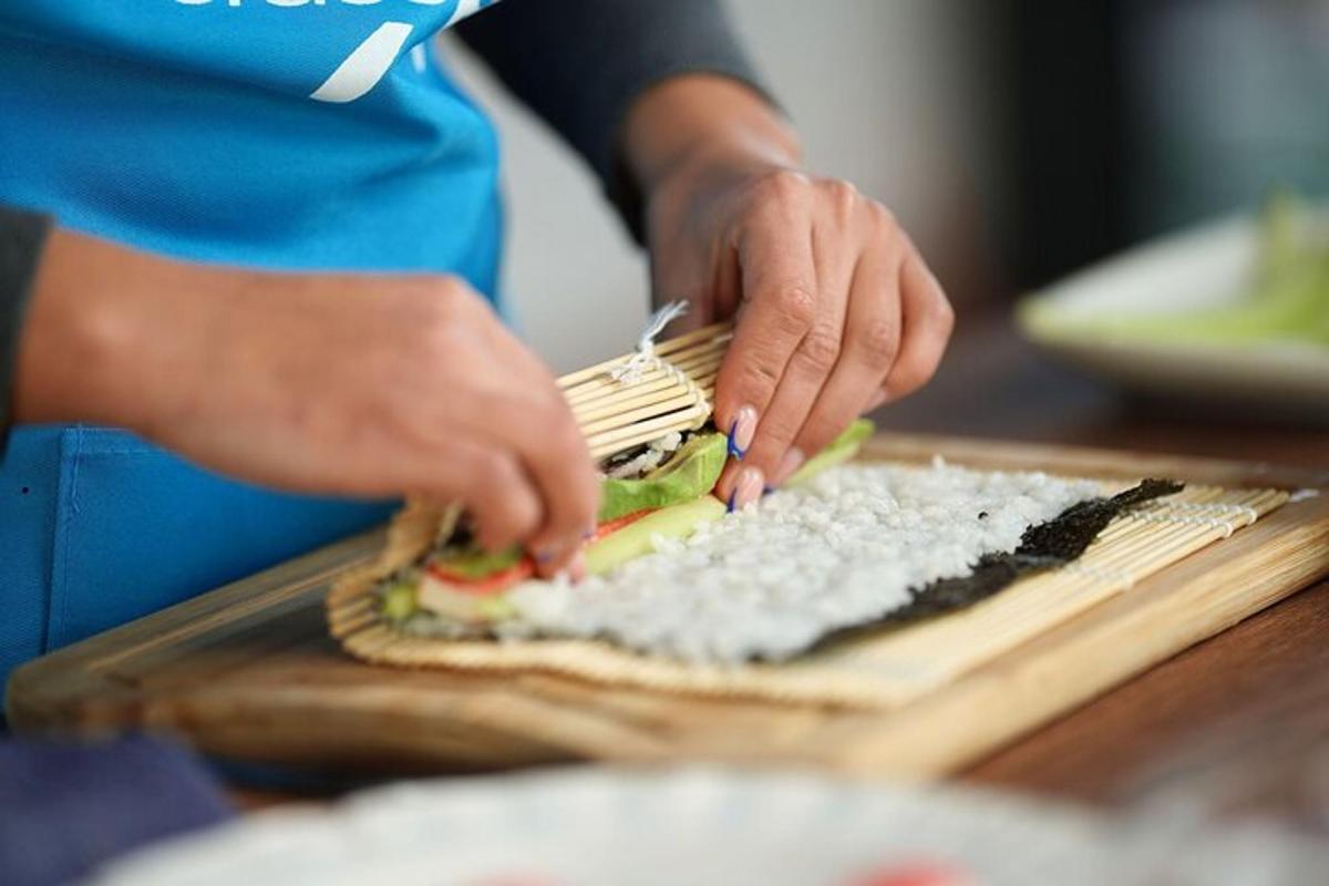 a person making a sandwich on a cutting board